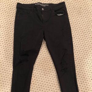 Black super stretch distressed jeggings. Size 14S
